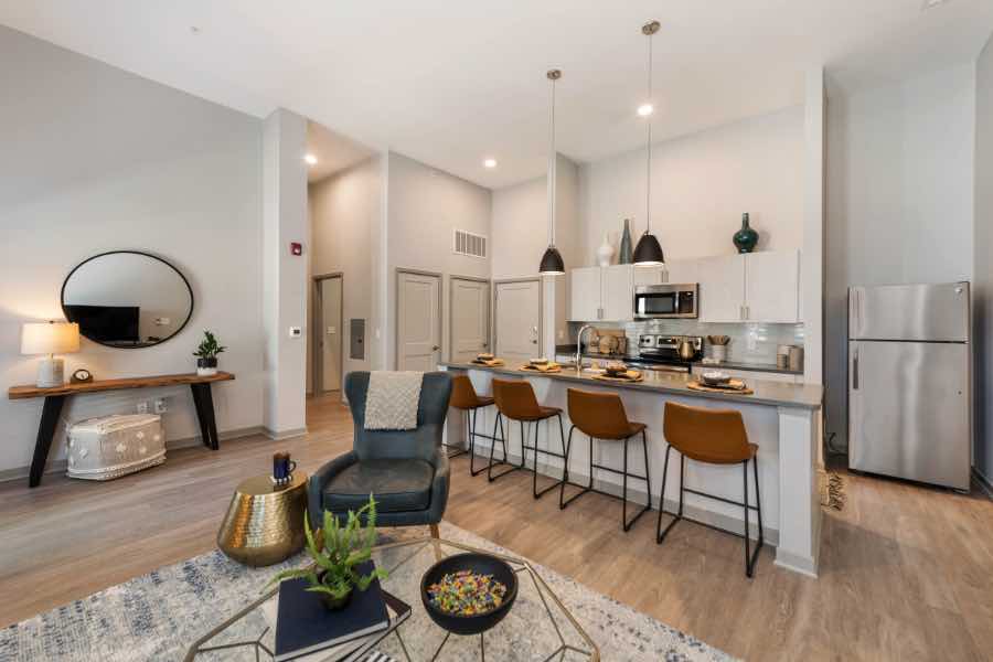When you move to a luxury unit like this one at Union Green Apartments, you can quickly complete your checklist. Kitchen with breakfast bar and high ceilings in apartment